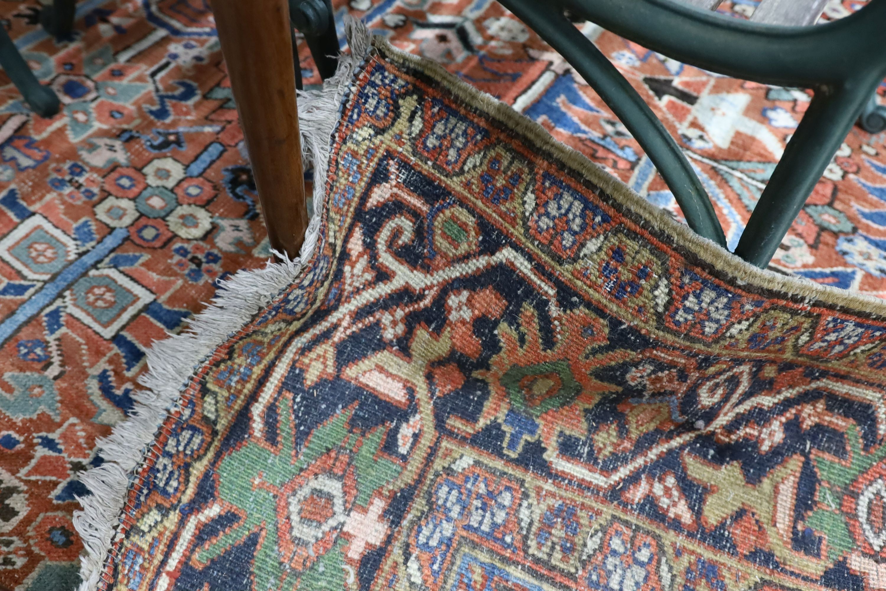 A Caucasian red ground carpet, 390 x 285cm